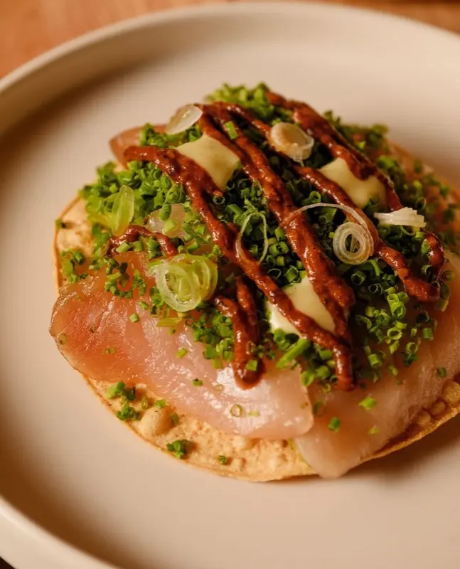 Plated Mexican dish topped with herbs at Acuyo Mexican Restaurant in Vancouver